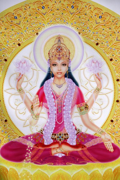 Bilde som viser Lakshmi, rikdommens gudinne og konsort av Lord Vishnu, som sitter og holder lotusblomster av Unbekannt