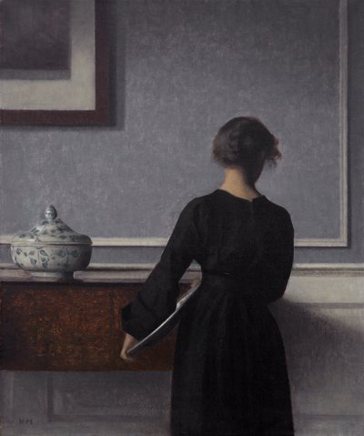 Interiør med ung kvinne bakfra av Vilhelm Hammershøi