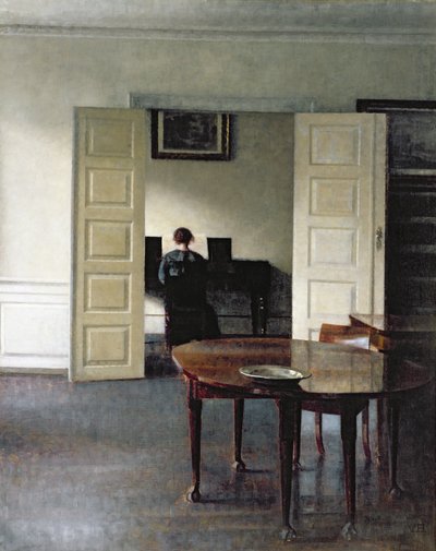 Et interiør med en kvinne som spiller piano, 1910 av Vilhelm Hammershoi