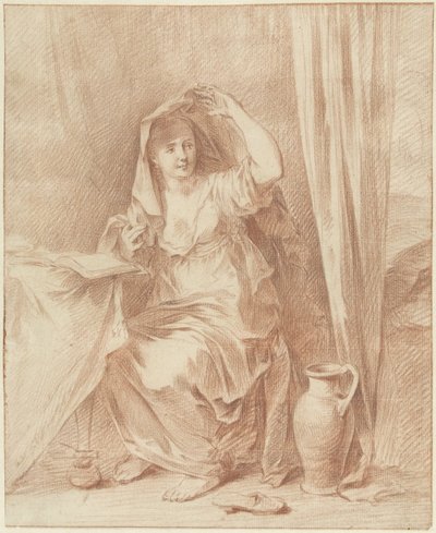 Kvinne sitter ved et bord bak en bok av Willem Joseph Laquy