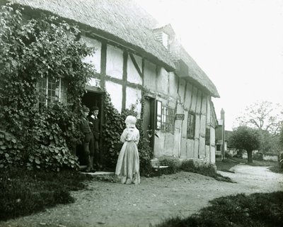 "Folk på dørstokken til en hytte" (Folk ved en hyttedør) av Frederick (attr. to) Barnard