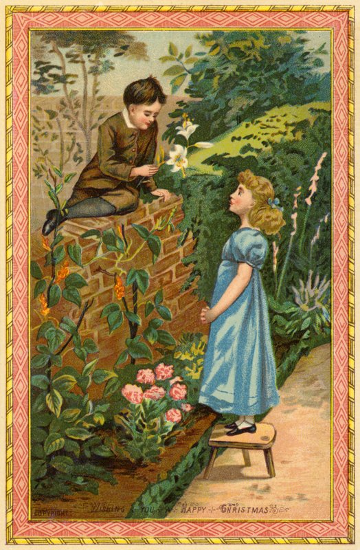 Gutt sitter på en vegg og tilbyr blomster til en jente av American School