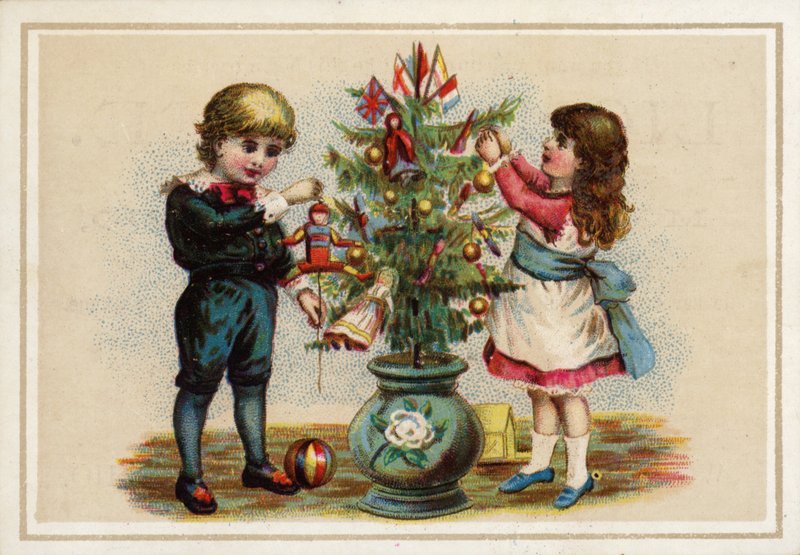 Barn som pynter et lite juletre av American School