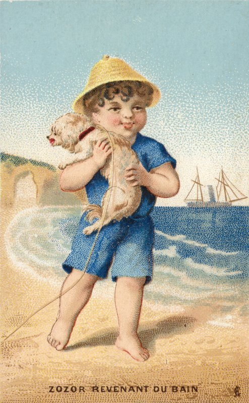 Gutt med hund på stranden av French School