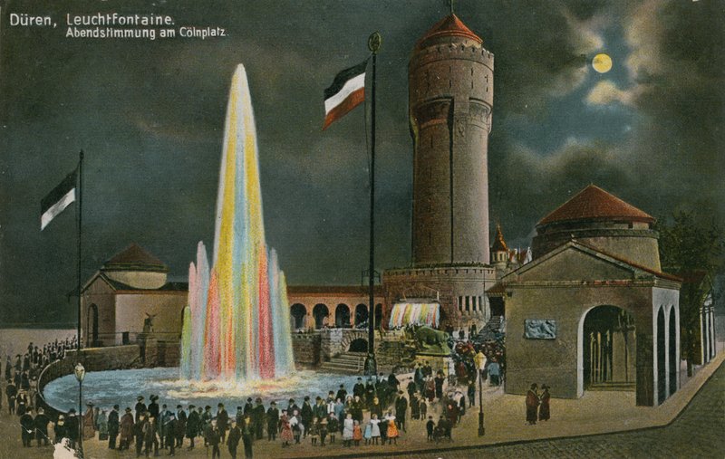 Düren, opplyst fontene, kveldsstemning på Colnplatz. Postkort sendt 20. mars 1913. av German Photographer