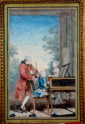 Wolfgang Amadeus Mozart (1756-1791) som barn ved pianoet med sin far og søster