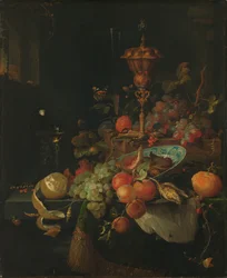 Stilleben med frukt og et beger på en hanefot
