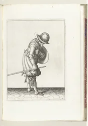 Skjold- og piggøvelsen: Soldaten setter piggen på bakken ved siden av sin høyre fot (nr. 16), 1618 Nassausche Wapen-Handelinge, van Schilt, Spies, Rappier and the Targe: beyde figuerlick avbildet, og innrammet etter den nye rekkefølgen [av] (...) M