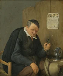 Gammel mann som holder et vinglass