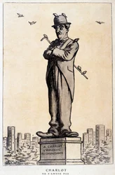 Charlot i statue med skrift på sokkelen: "En Charlot, den takknemlige menneskeheten"" ("Charlot ne s