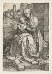 Jomfru Maria sitter ved en vegg