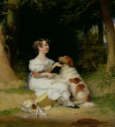 En ung jente med sin spaniel