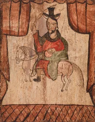 Figur som rir på en hest