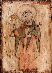 Saint som holder et stearinlys