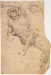 Sittende mannlig modell lenket til en stein og en studie av hodet