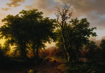 Reisende på en sti ved solnedgang