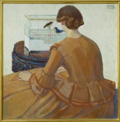 Ung kvinne foran et fuglebur