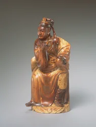 En figur av Guandi sittende, 1300-1400-tallet (utskåret elfenben)