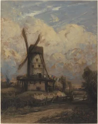 En vindmølle mot en overskyet himmel