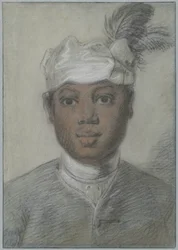 Hodet av en ung svart mann med en turban med fjær