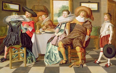 Elegante figurer som fester ved et bord
