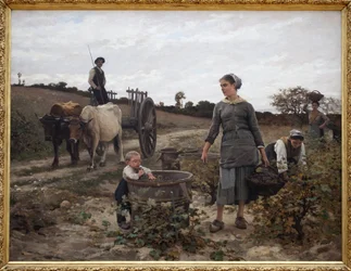 Hjørne av vintreet; Languedoc. Landlig scene med en mann på en vogn, kvinner som plukker druer og et barn som spiser de høstede fruktene. Maleri av Edouard Debat Ponsan (1847-1913), olje på lerret
