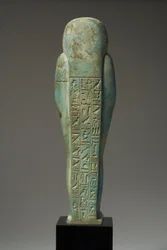 Sett bakfra av en ushabti-figur for Hor-Khebi, sendynastisk periode, sent 25.-tidlig 26. dynasti, ca. 700-600 f.Kr. (fajanse) (se 270353 for front)