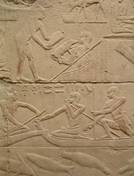 Relieff som viser en mann som passer på en nyfødt grisung og menn i papyrusbåter, fra Mastaba i Kagemni, Old Kingdom (malt kalkstein)