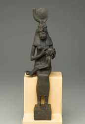 Sittende statuett av Isis som holder Horus (bronse)
