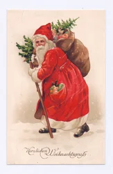 Edwardiansk postkort av julenissen som bærer et juletre og en sekk med leker over skulderen, ca. 1910 (fargelitografi)