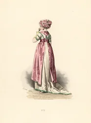 Kvinne i hvit kjole og corsage med grønn kant, rosa forkle.