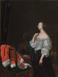 En kvinne som står foran et speil