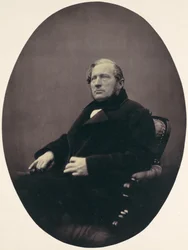 [Mann sitter i lenestol], 1850-60-tallet.