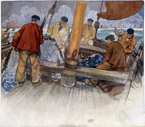 Fiskere tømmer et garn om bord