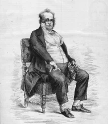 Portrett av Henry Monnier (1799-1877), fransk dramatiker, tegneserieskaper og komiker. Han er kledd som "Monsieur Prudhomme", en karakter oppfunnet av Monnier, en tegneserie av den franske borgerskapet på 1800-tallet. Gravering i "" Le Monde Illustré"" n°1