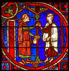 Vindu w1 som viser en scene fra Theophilus-historien: han ber om hjelp fra en tryllekunstner