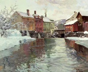 Snødekte bygninger ved en elv