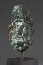 Fartøystut i form av hodet til Herakles (bronse)
