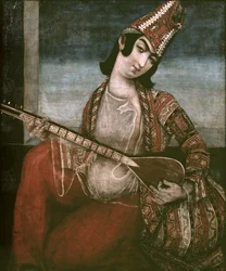 Ung kvinne som spiller gitar