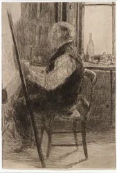 Kunstner sittende ved staffeli