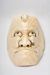 Okimono maske skåret ut som en karakter fra Kabuki eller annet teater