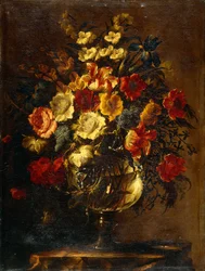 Blomster i en glassvase på en stein,