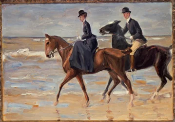 Rytter og kvinnelig rytter på stranden