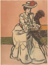 En elegant Parisiènne sitter på en kafé
