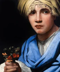 Gutt med turban som holder en blomsterbukett