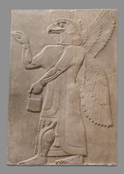 Relieffpanel med bevinget overnaturlig figur med ørnehode, ca. 883-59 f.Kr.