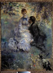 Elskende. Par som sitter i en hage. Maleri av Pierre-Auguste Renoir (1841-1919)