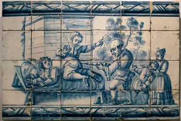 Legen gir en pasient et klyster - Satirisk panel fra Lisboa, første halvdel av 1700-tallet (Lege - Satirisk panel, første halvdel av 1700-tallet) - Det nasjonale azulejo-museet, Lisboa (Portugal)