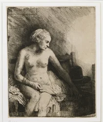 En kvinne ved badet med en hatt ved siden av seg, 1658