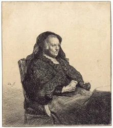 En eldre kvinne (Rembrandts mor, sittende ved et bord)